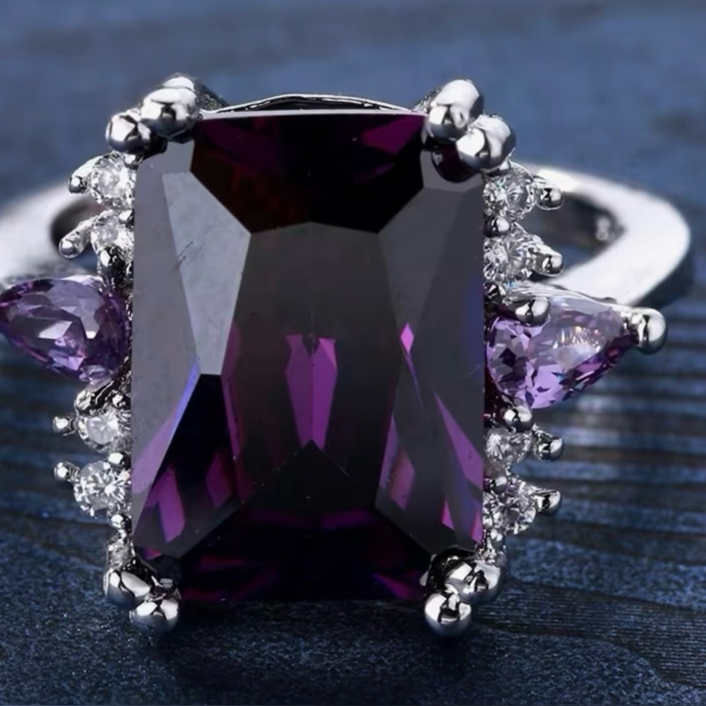 Elegant Ring with large Amethyst Color Stone.  Silver plated.  Size 8
